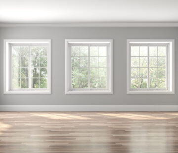 Classical empty room interior 3d render,The rooms have wooden floors and gray walls ,decorate with white moulding,there are white window looking out to the nature view.